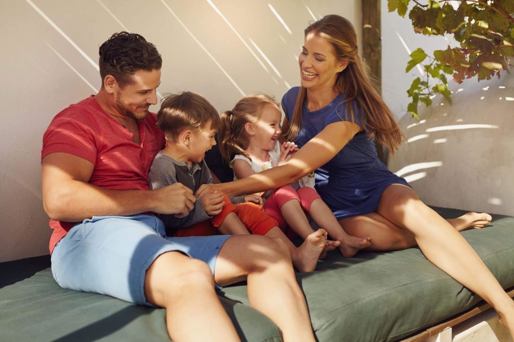 smiling family on patio