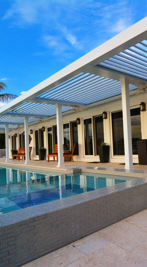 white pergola near pool